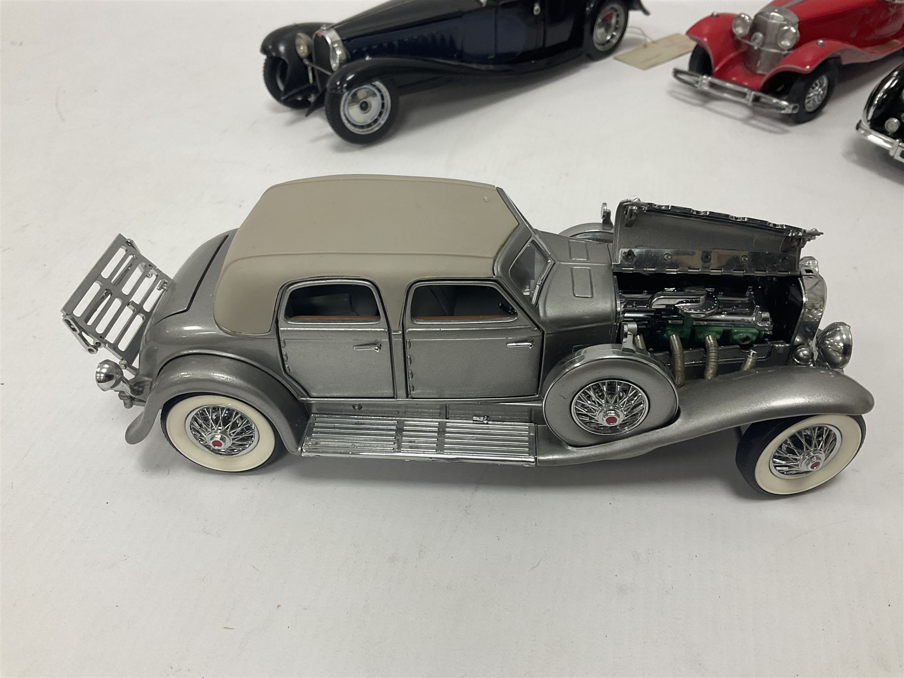 Franklin Mint - five 1:24 scale die-cast precision models comprising 1930 Bugatti Royale Coupe Napoleon, 1933 Duesenberg SJ Twenty Grand, 1935 Mercedes Benz 500K Special Roadster, 1938 Jaguar SS-100, and 1947 Bentley 