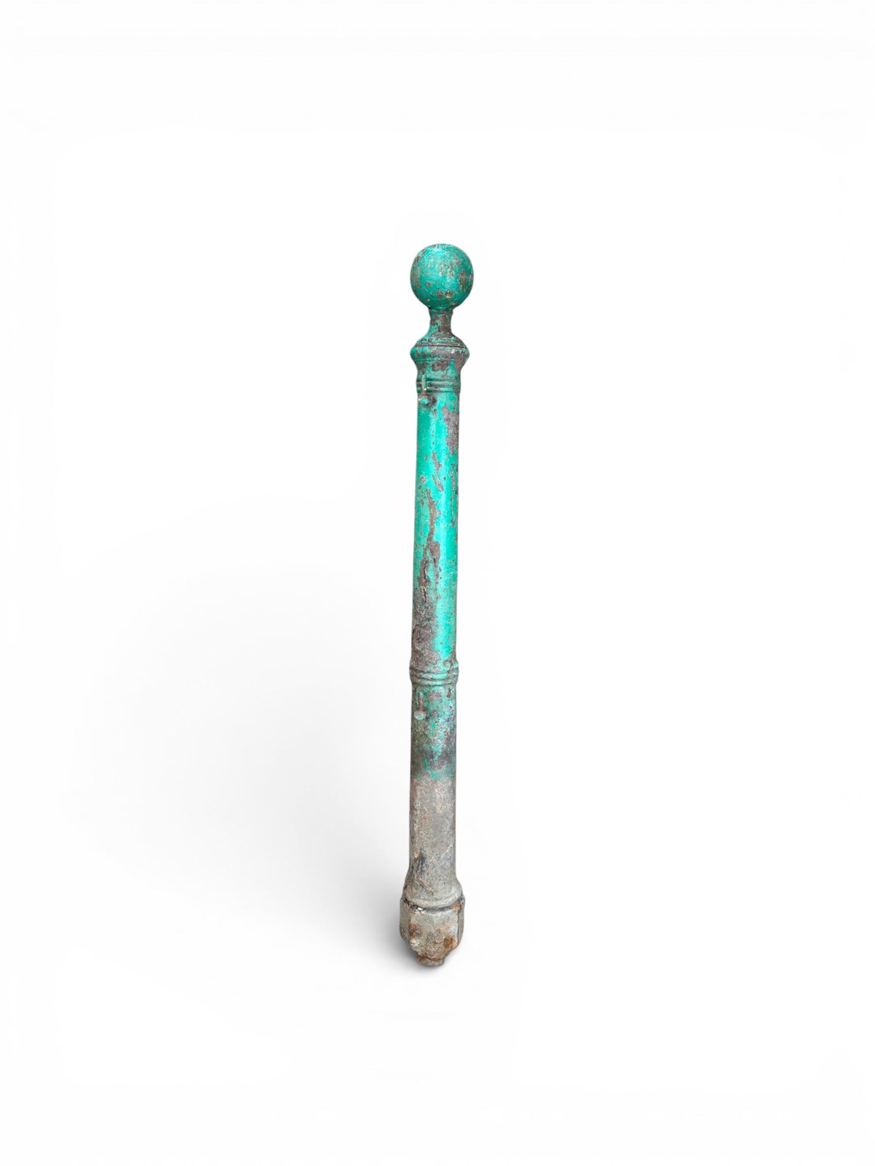 19th century circular cast iron gate post with finial, painted in distressed green finish