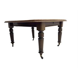 19th century mahogany extending dining table, telescopic action, rounded rectangular moulded top, on turned and fluted supports with brass and ceramic castors