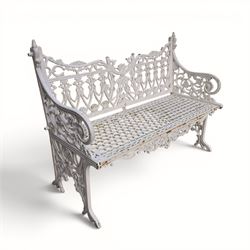 Victorian revival heavy cast iron garden bench, ornate back rest with scrolls, floral motifs and central crest, pierced lattice seat, curved arms and decorative legs, painted in antique white, in the Gothic Coalbrookdale style - Damaged 