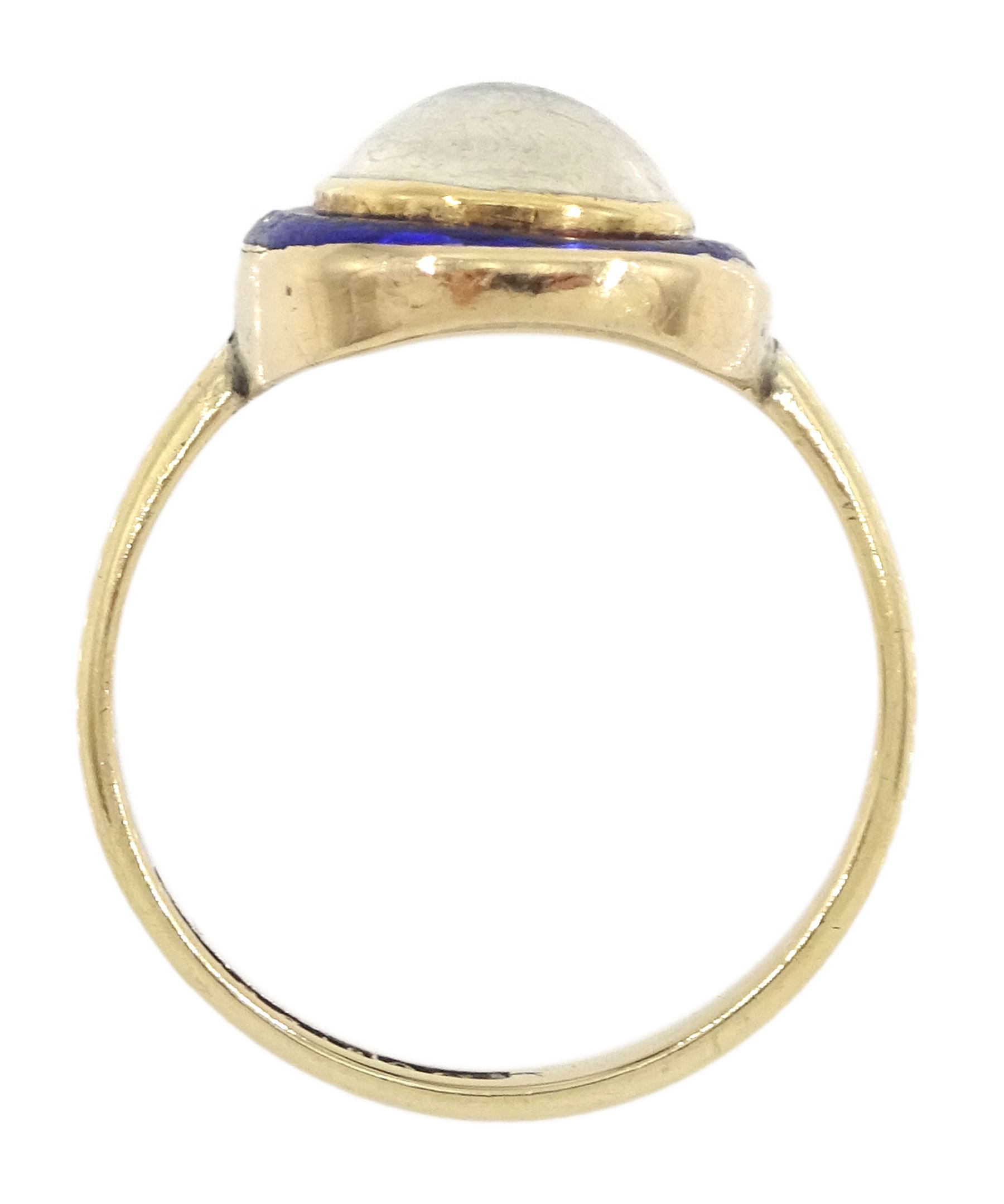 Early 20th century moonstone and blue enamel ring, stamped 9ct