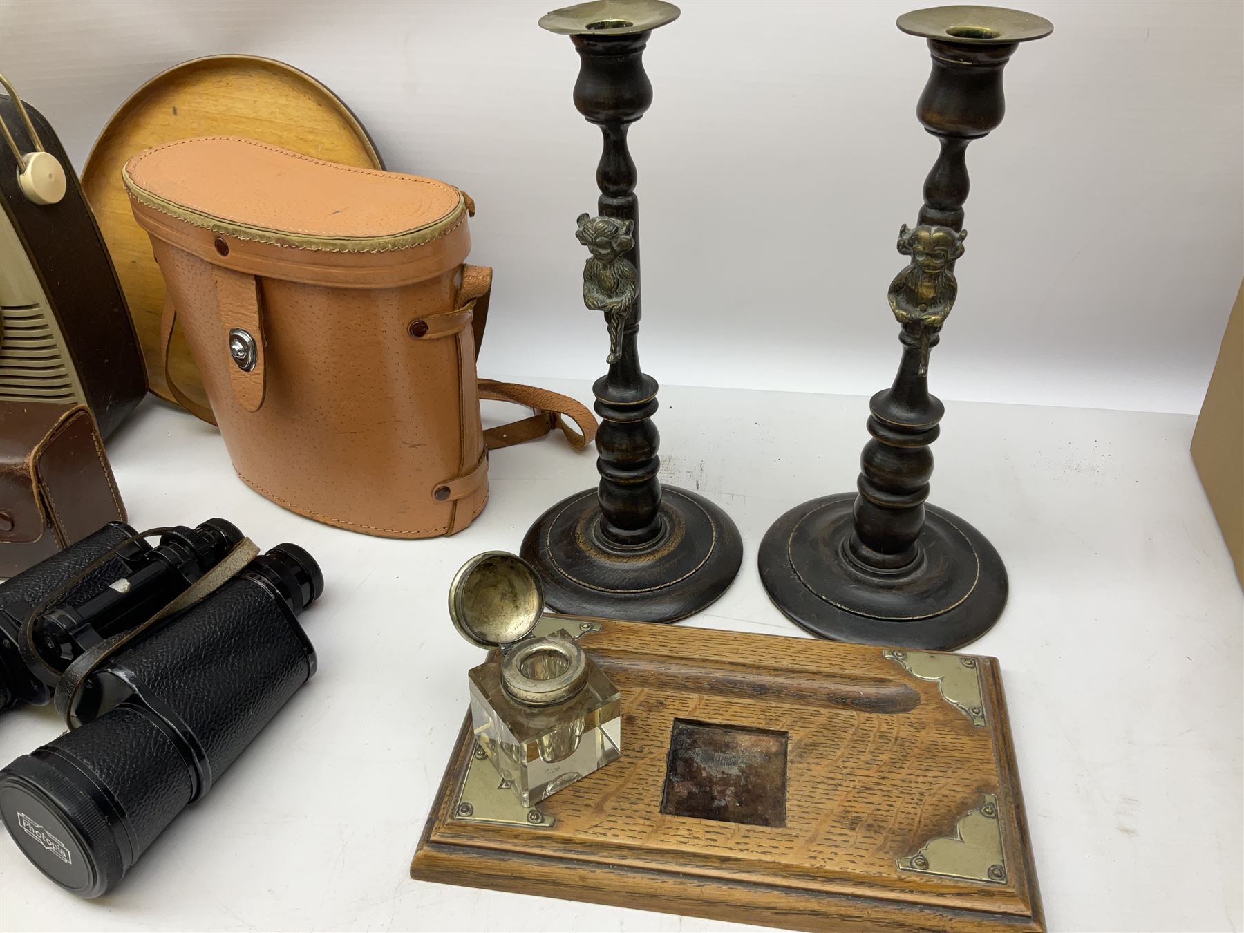Pair of Rayswi of Harrogate carved oak candlesticks with brass mounts, in the form of an imp, together with a cased pair of Photopia binoculars, mother of pearl opera glasses, Bush radio, oak inkstand etc