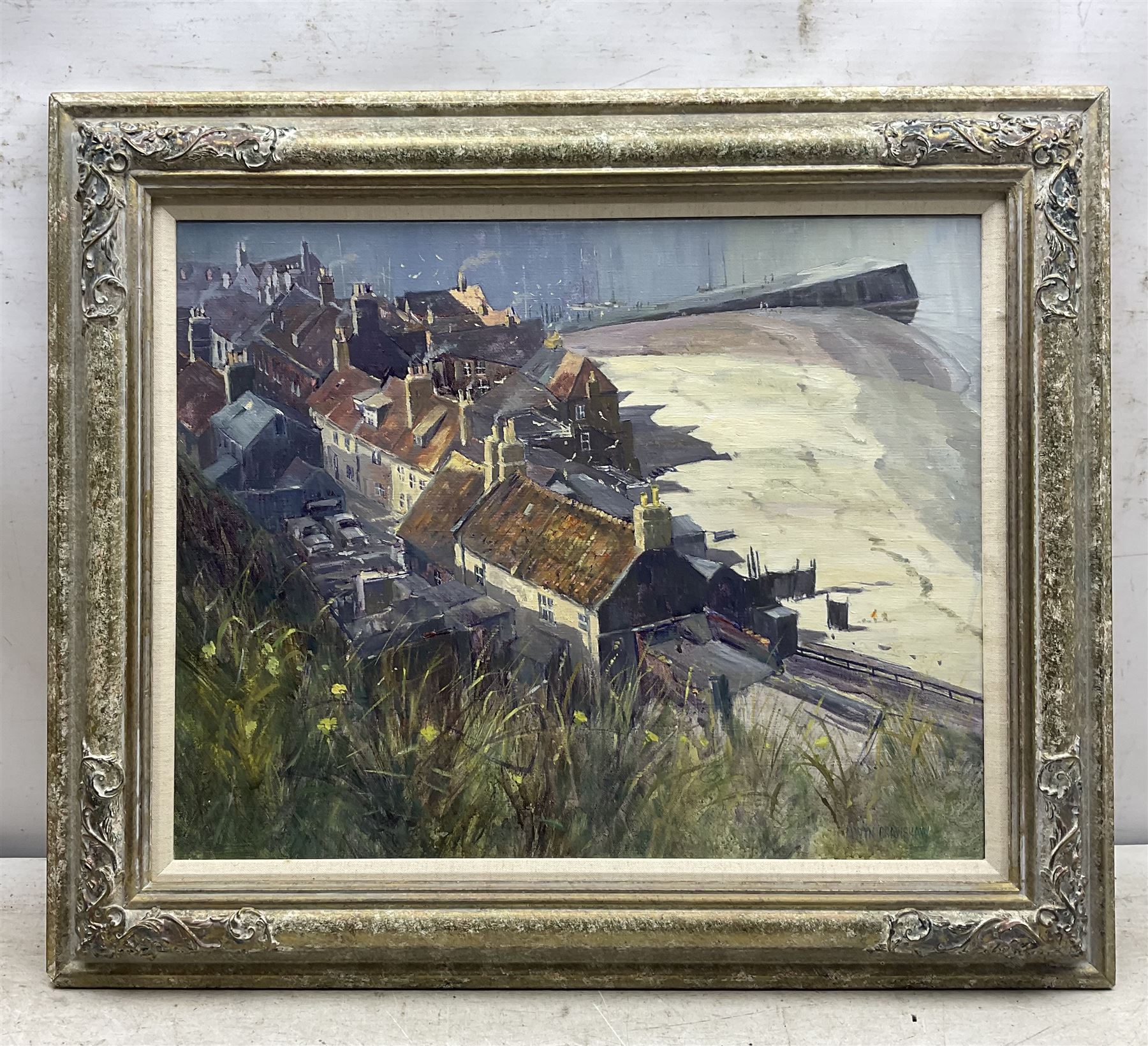 Alwyn Crawshaw (British 1934-): 'Early April Sun - Whitby' - View from the Abbey looking down onto South Bay, oil on canvas signed, inscribed verso 40cm x 50cm