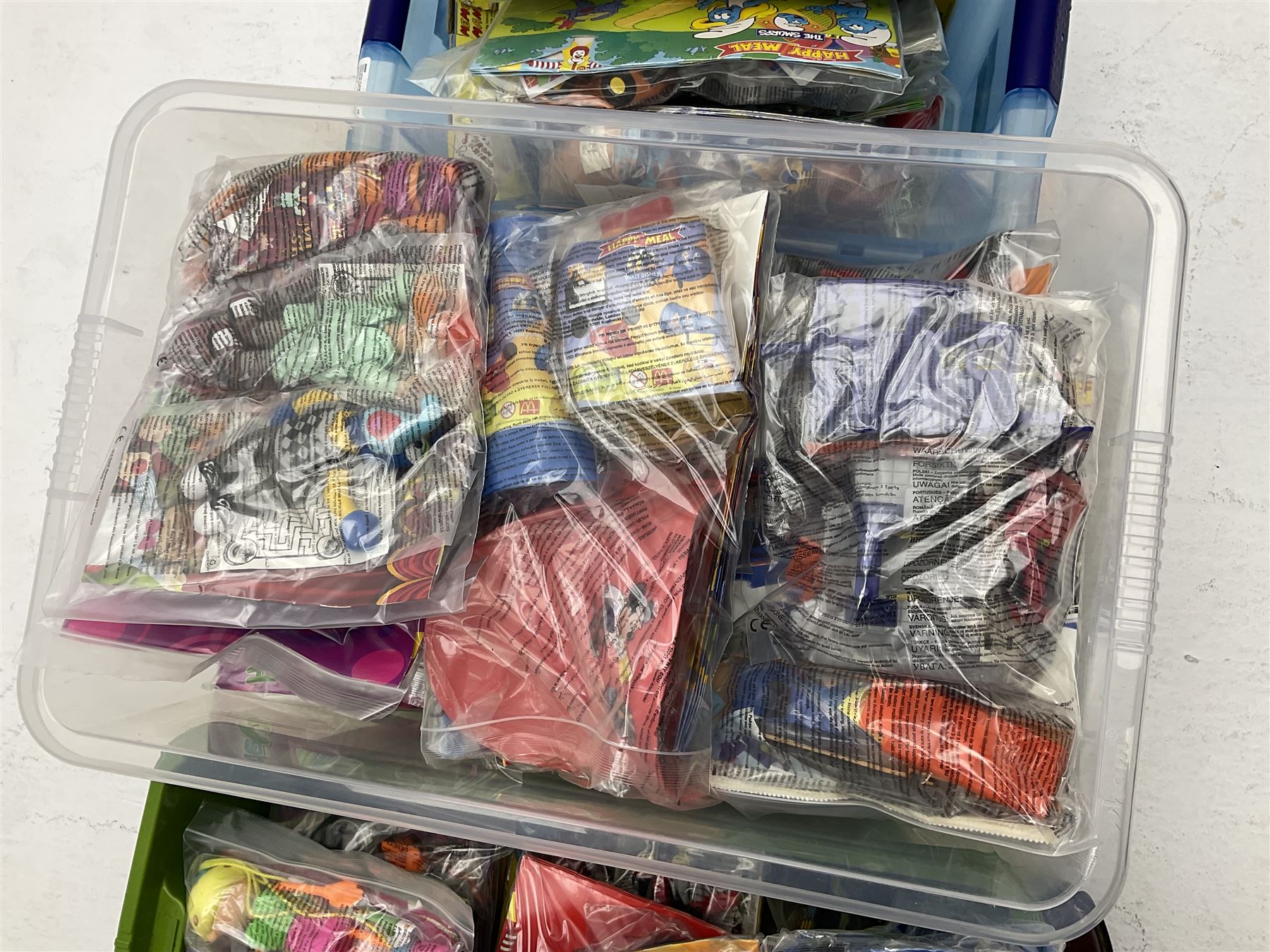 Large quantity of Mcdonalds toys in three boxes
