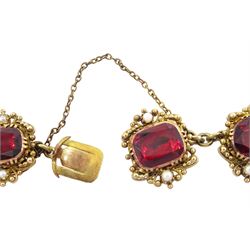 Early 20th century gold garnet and pearl bracelet, each link set with a foiled back garnet, with two seed pearls set at each side, within a bead work setting