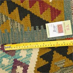Afghan Maimana flatweave kilim runner, central field features large bold nested diamond motifs and stylized geometric lozenge patterns on olive purple, blue, and green tone ground, dark green border stripe, with fringe ends
