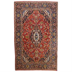Central Persian Kashan hand-knotted rug, madder red field, with central lobed medallion wi...