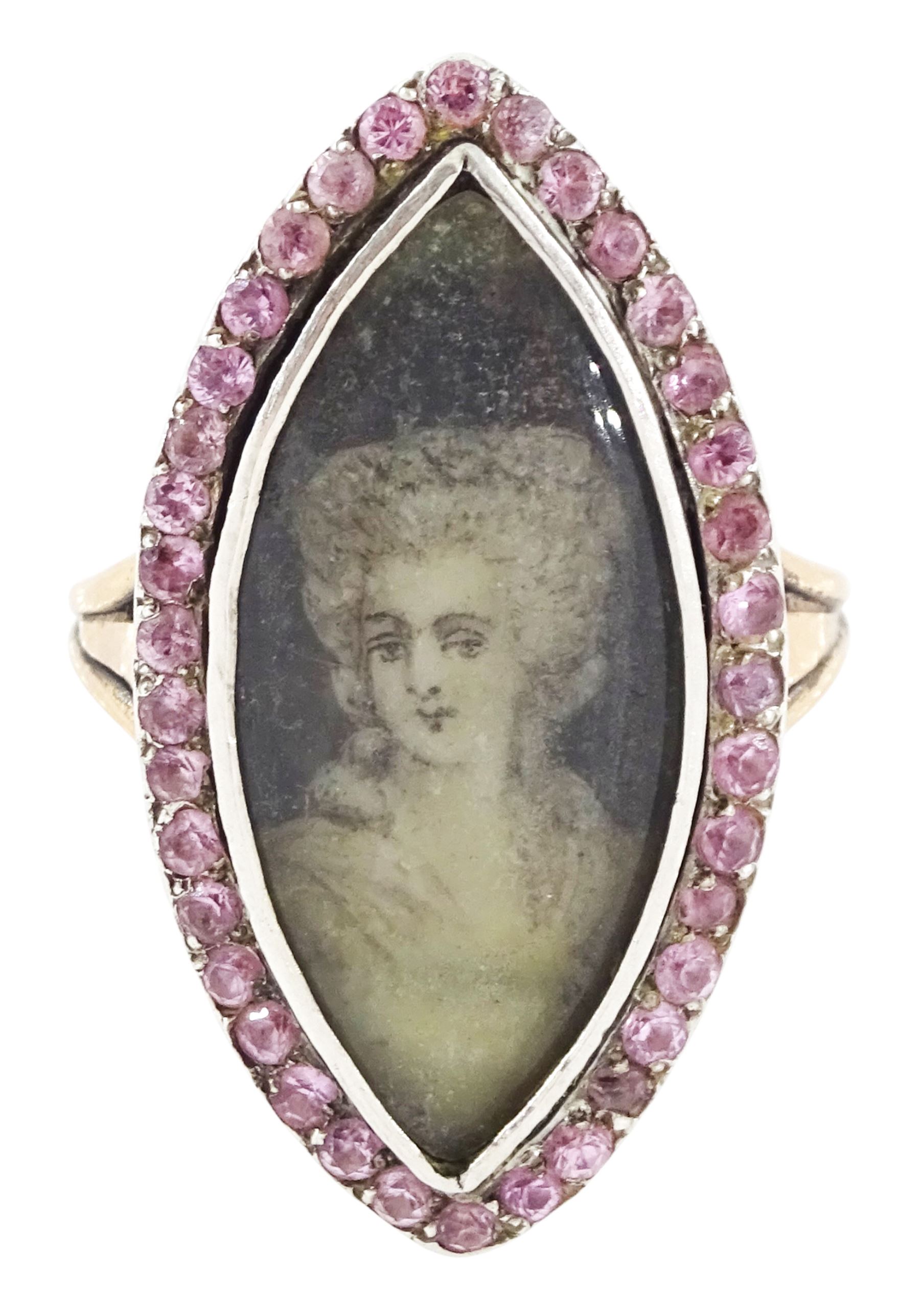 18th / 19th century gold and silver paste stone set portrait ring, the navette bezel set with a miniature of a woman on ivory, under a glazed panel, within a pink paste border and trifurcated shoulders. This lot has been registered for sale under Section 10 of the APHA Ivory Act