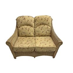 Four piece cane conservatory suite - two seat sofa (W130cm), pair of armchairs (W85cm), and coffee table (85cm x 60cm)