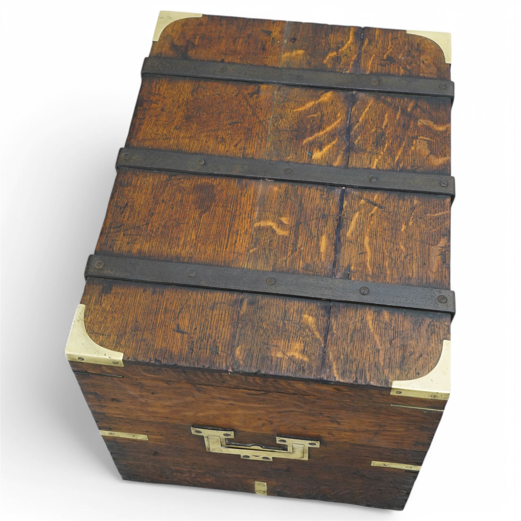 19th century oak and metal bound box, hinged lid enclosing vacant interior, bound with wrought metal straps and fitted with brass corner caps, two heavy weight brass carrying handles 