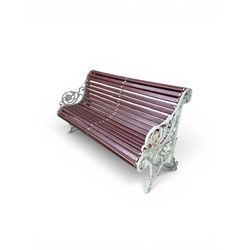 Large late Victorian cast iron garden bench, serpentine form with scroll back and seat, slatted with mahogany stained Sapele