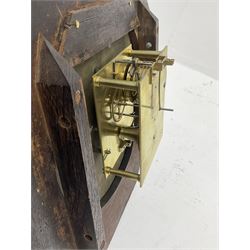 Mid-19th century mahogany veneered eight-day four-pillar single fusee drop dial wall clock with an octagonal dial surround and scroll brass inlay, circular painted steel dial with roman numerals and minute track, matching trefoil steel hands, brass bezel with a flat glass, curved trunk with brass inlaid circles and stringing around the glass pendulum aperture with a brass slip, carved ear pieces in the form of flowers and leaves, with pendulum adjustment door and movement door. With Pendulum & Key