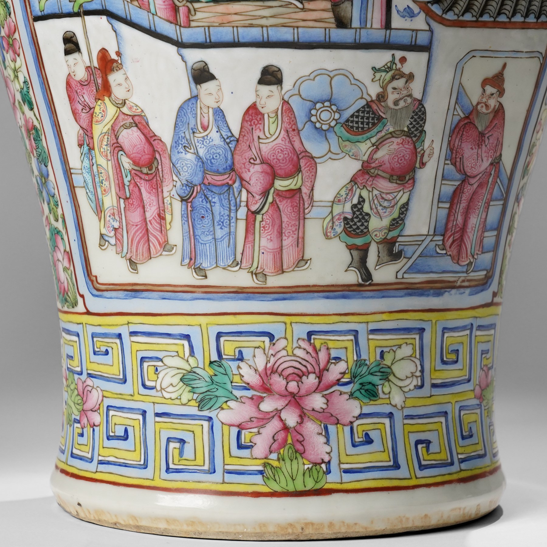 Large pair of 19th century Cantonese famille rose vases, each painted with various courtly scenes, including a display of warriors fighting on horseback before an official and his attendants, double Buddhist lion handles and applied at the shoulders with chilong, the lower band painted with Greek key motif, H58cm (2)