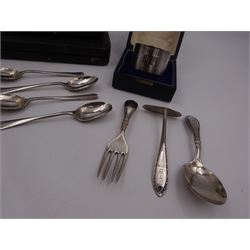 Group of silver, comprising two engraved napkin rings, Christening fork and spoon, engraved with name, similar pusher, four teaspoons and a miniature silver mounted photograph frame, all hallmarked