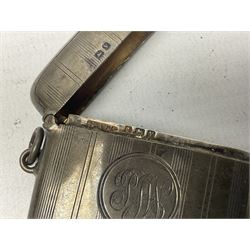 Mid 20th century silver vesta case, together with a modern silver toothpick, each hallmarked