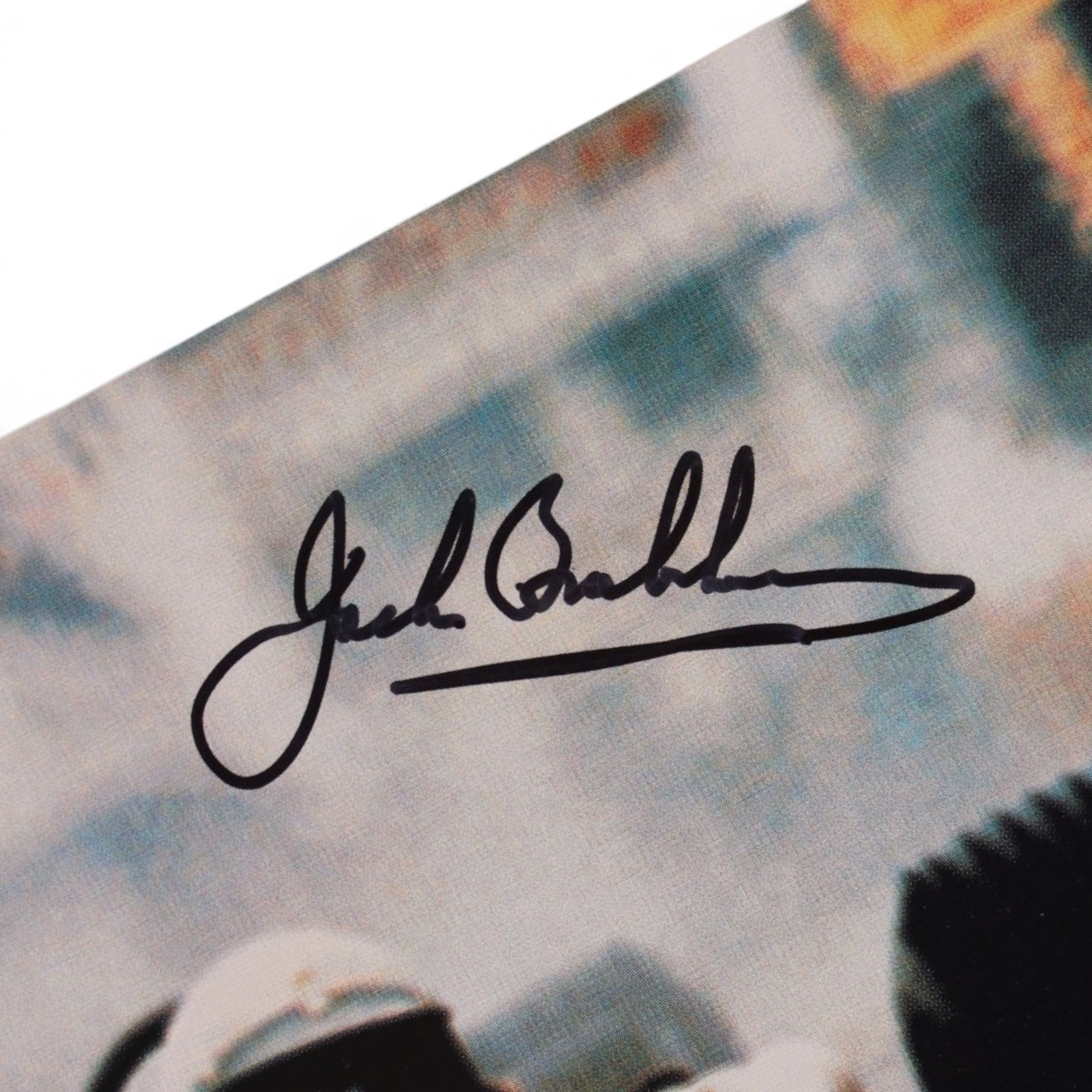 Signed Formula 1 memorabilia, including 1973 Milestones magazine signed to the front cover by Graham Hill and three signed photographs comprising Jackie Stewart, Jack Bradbury and Mario Andretti, with certificate of authenticity from Chaucer Auctions