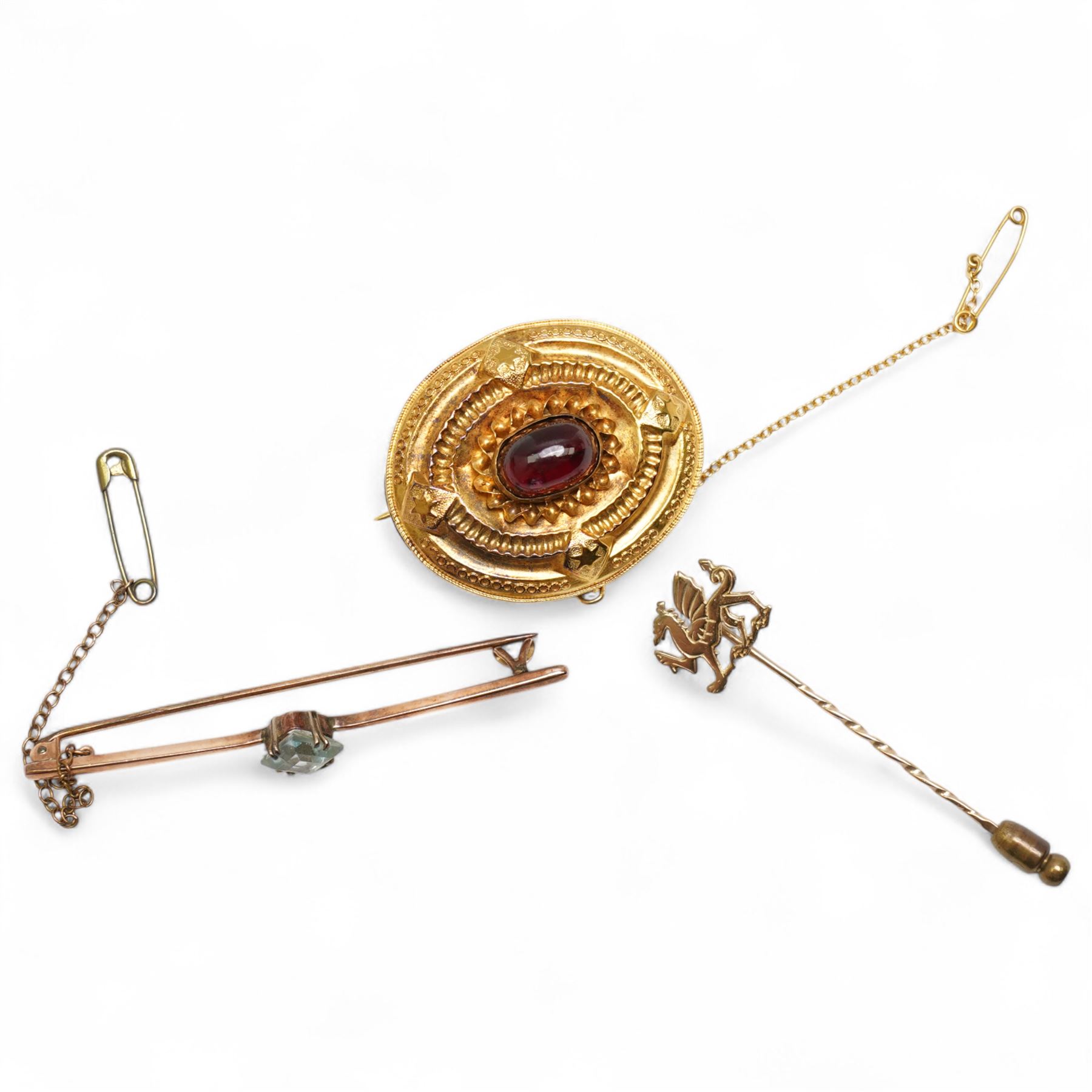 Victorian gold garnet brooch, with glazed back, 9ct gold blue stone set brooch and a 9ct Welsh Dragon pin