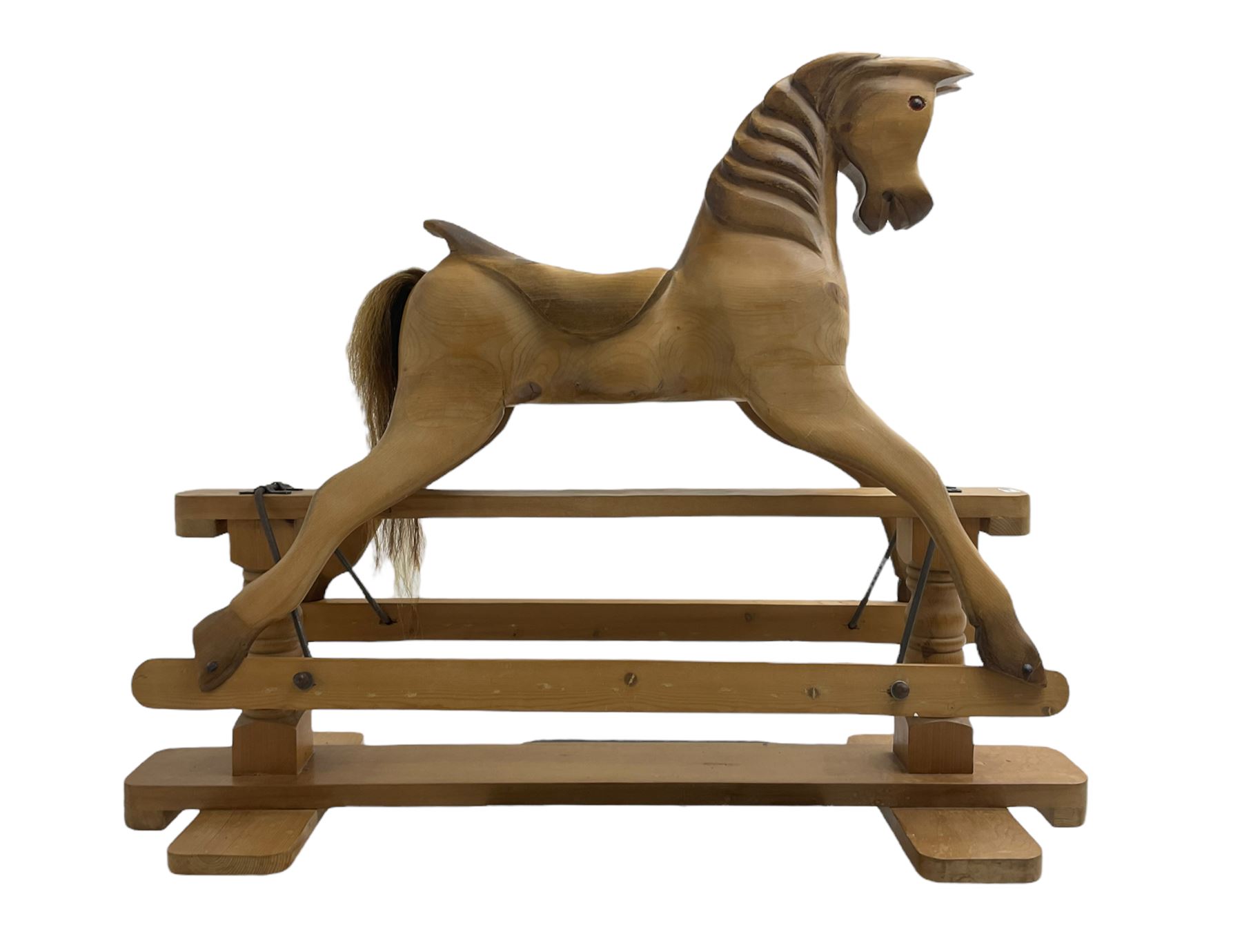 Terry White for White Horses (Hertfordshire 20th century) - Carved pine rocking horse, raised on a pine trestle base