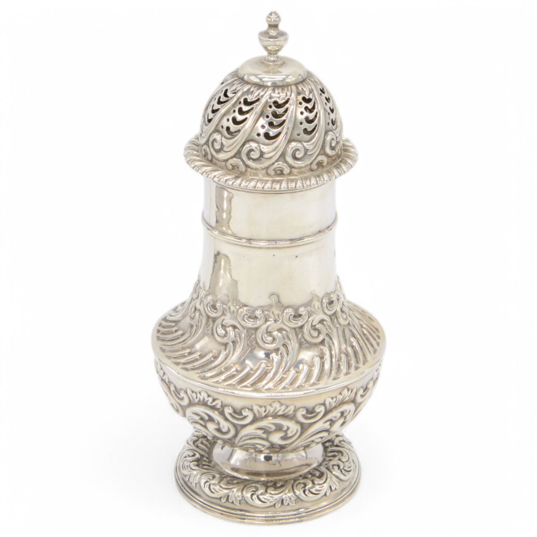 Late Victorian silver sugar caster, of typical waisted form, with embossed scrolling and foliate decoration and urn finial to removable pierced cover, upon circular foot, hallmarked Fenton Brothers, Sheffield 1895, H19cm