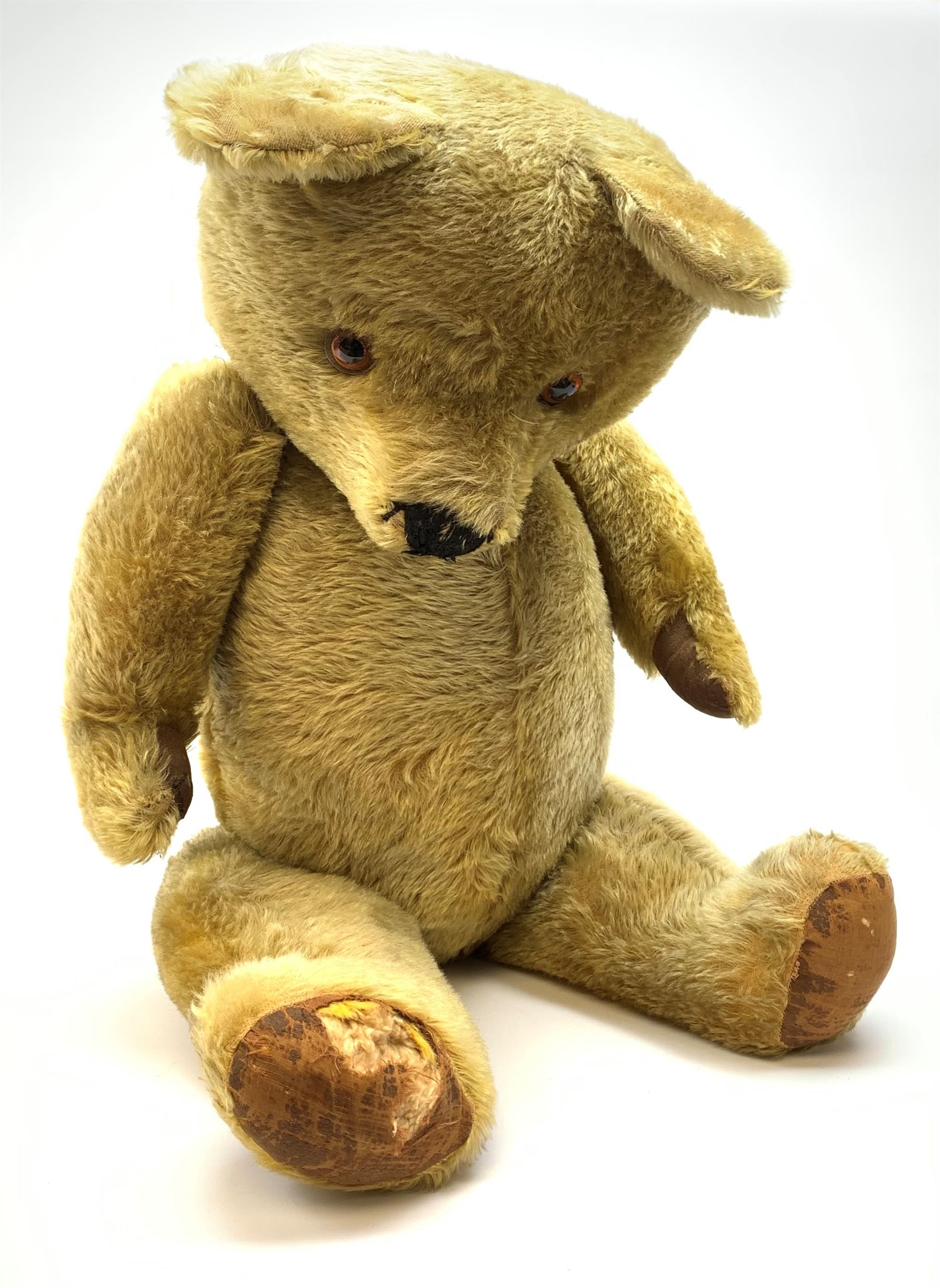 Very large Irish Tara bear c1950s with plush covered body, swivel jointed head with glass eyes and vertically stitched nose and mouth, jointed limbs with rexine pads and growler mechanism H37