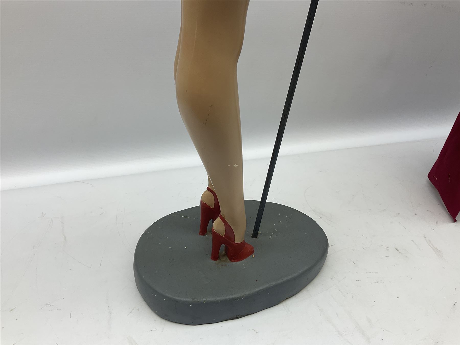 Composite Superman with cape, together with a composite female statue holding the American flag, tallest example H103cm