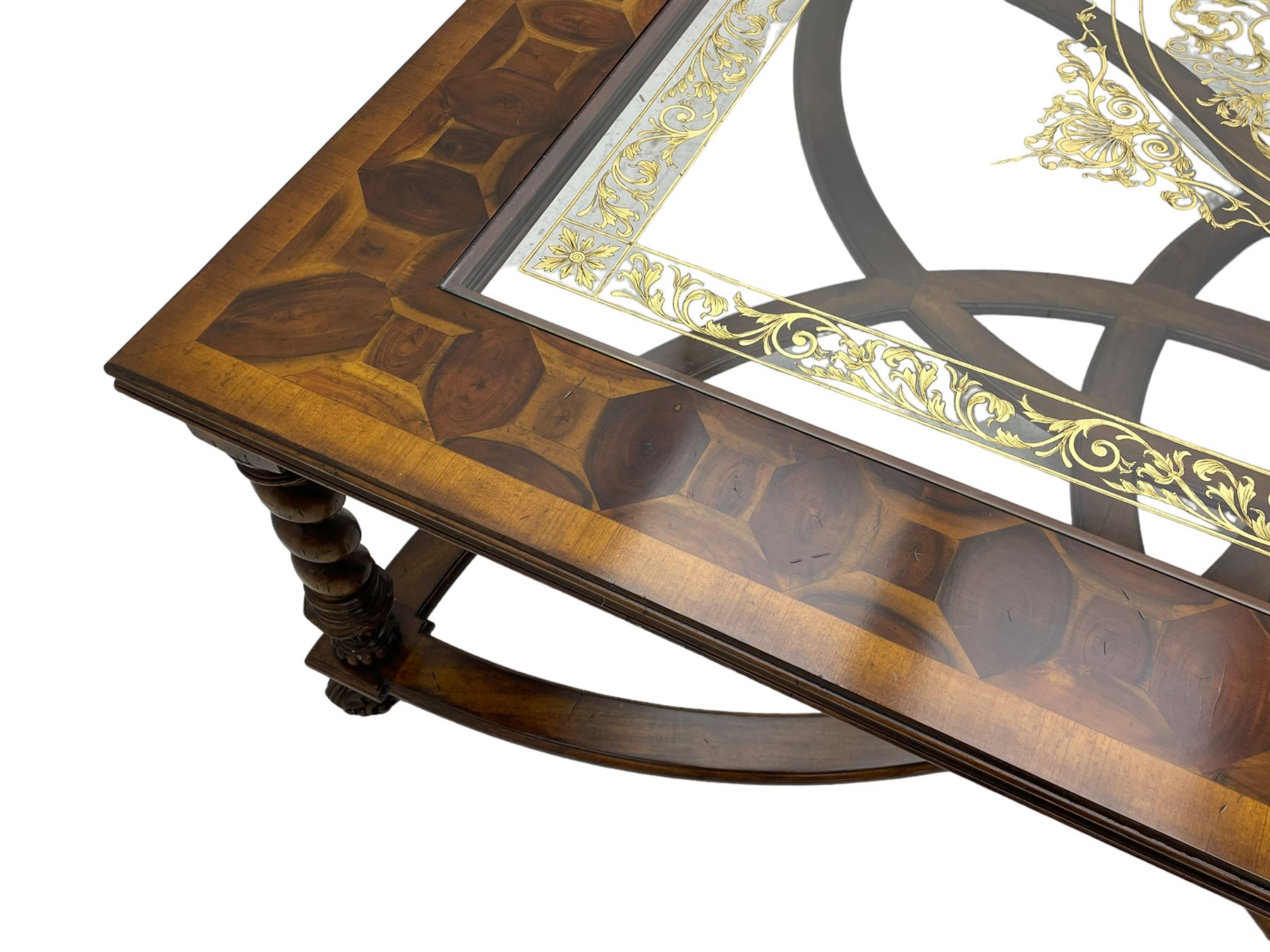 Jonathan Charles - large mahogany coffee table, the square oyster veneered top with verre églomisé inset, the glass hand-painted with gilt scrolling foliate patterns, raised on spiral turned supports with acanthus and gadroon carvings, united by interlocking demi-lune stretchers, on scrolled acanthus feet