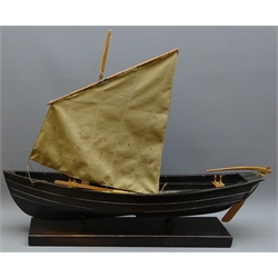  Large model of a Whitby Coble, rigged with oars on integral stand, L73cm, H58cm  