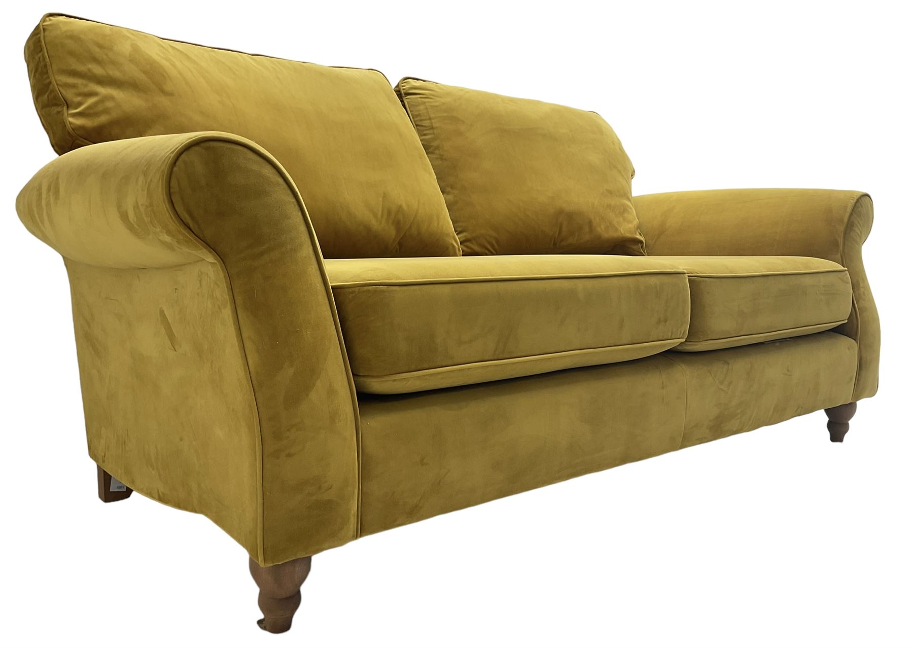 Next Furniture - traditional shaped three-seat sofa, upholstered in mustard velvet, rolled arms with pipping, on turned front feet