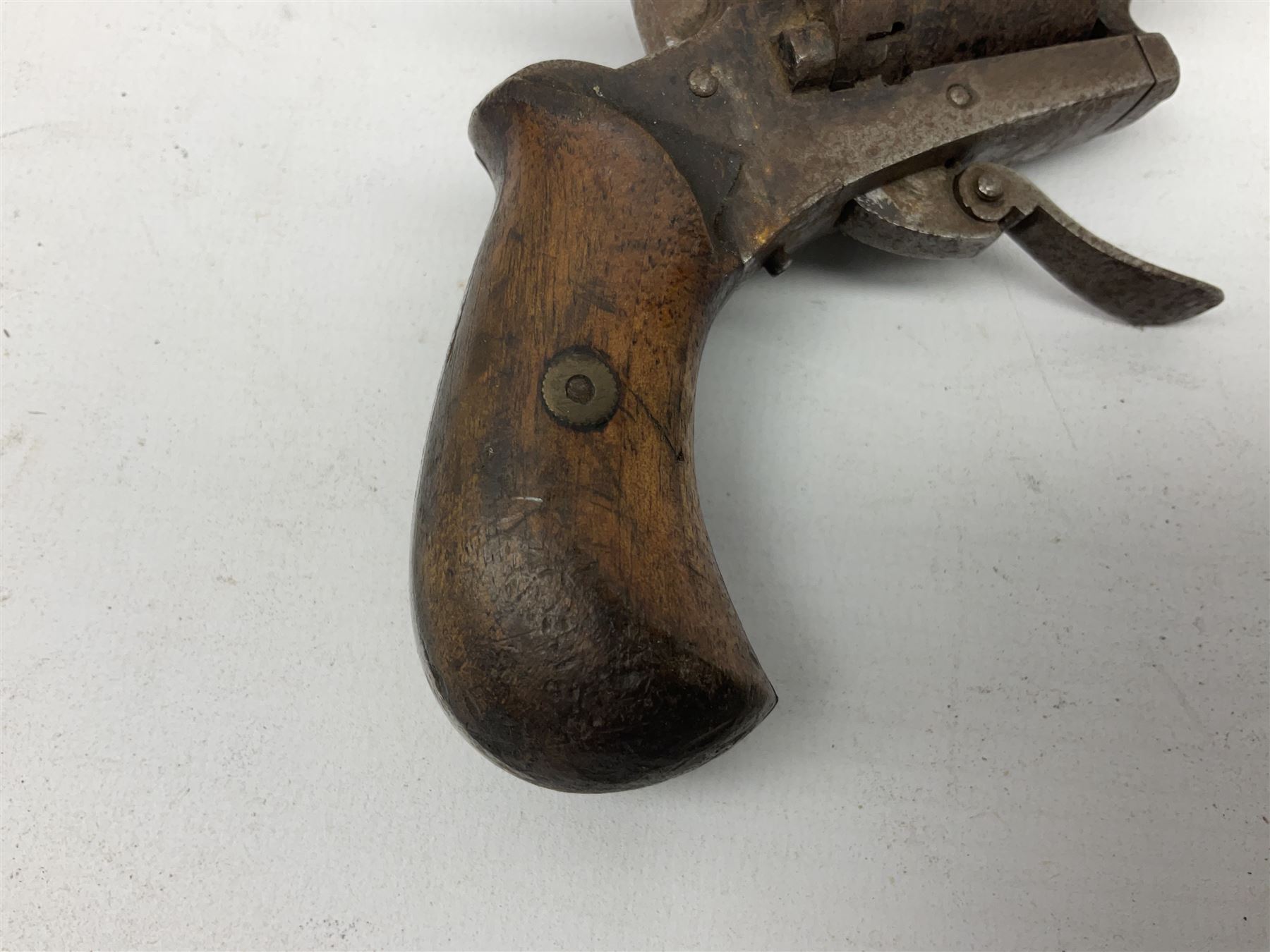 19th century 7mm five-shot pin-fire revolver, the cylinder marked 'The Savety (sic) American Revolver 1879', with folding trigger and two-piece walnut grip L18cm