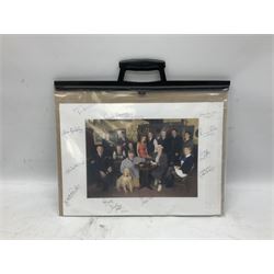 Photograph of the cast of Heartbeat posing in costume in the Aidensfield Arms and signed by twelve cast members including John Duttine, Tricia Penrose, Clare Wille, Derek Fowlds, Gwen Taylor, Lisa Kay, Peter Benson etc; unframed