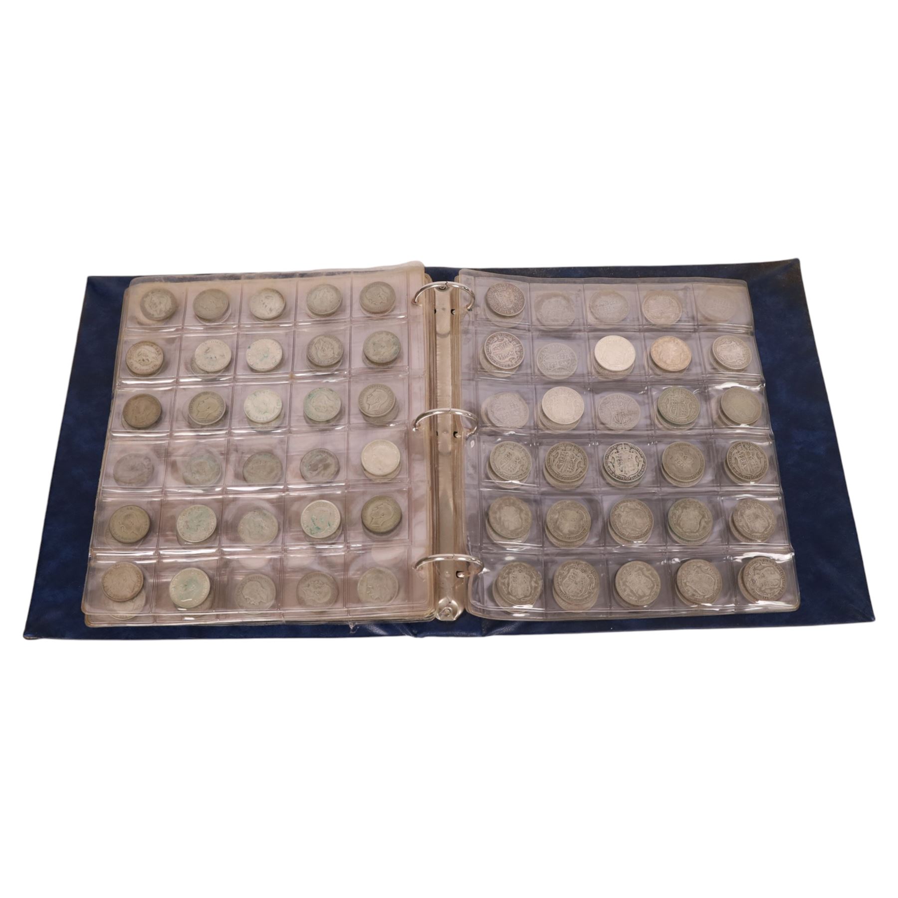 Great British pre-1920 and pre-1947 silver coins, including six pre-1920 and seventy-two pre-1947 half crowns, eight pre-1920 and forty-seven pre-1947 florins, nineteen pre-1920 and approximately one hundred pre-1947 shillings, etc, housed in a blue ring binder folder