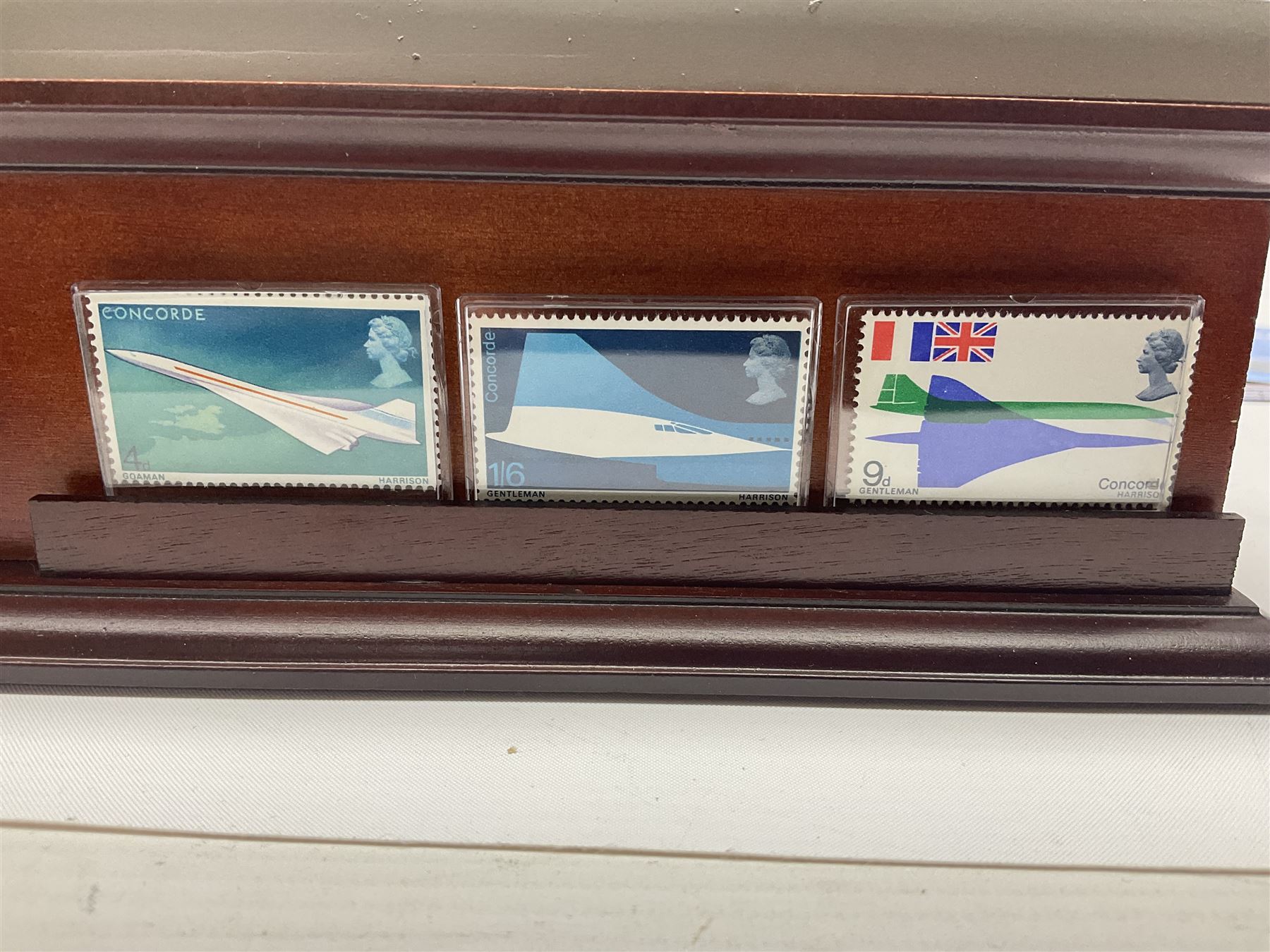 Danbury Mint 'The Ultimate James Bond Collection' comprising stamps and coins housed in a display case, 'Concorde Queen of the Skies' sculpture, stamps, medallion display and 2020 'Centenary of the Unknown Warrior' five pound coin cover in Harrington and Byrne folder