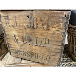 Two wicker baskets, three pine lidded bottle crates with quantity of glass bottles, comprising one with R.L. June & Co Ltd Mansfield black lettering and pair detailed Mandora Soft Drinks, Mappin & Webb blue cardboard box and framed With the Colours Punch 1924 print, larger basket W60cm