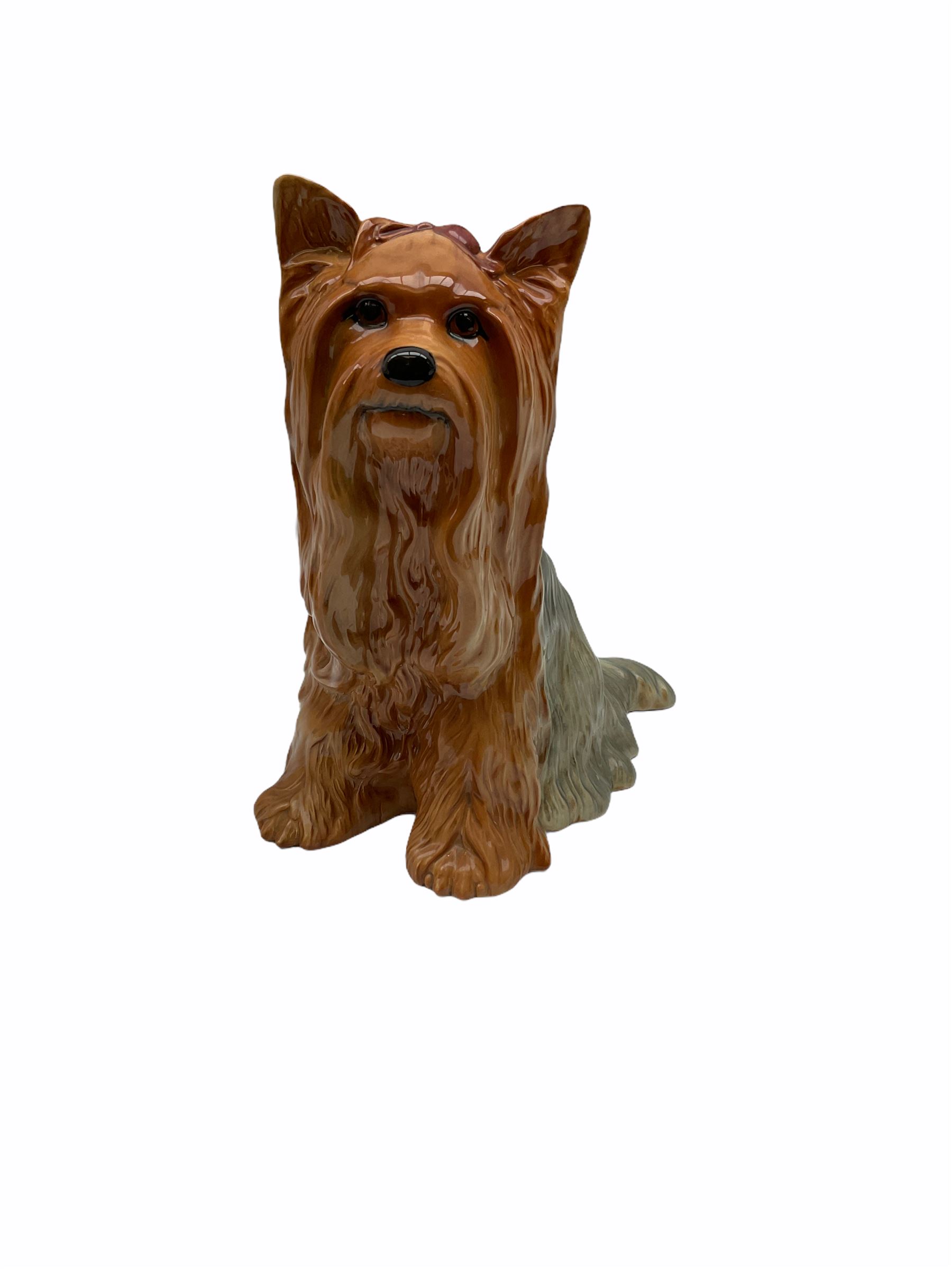 Beswick fireside Yorkshire terrier dog model no 2377 H25.5cm, together with a pair of staffordshire style white spaniels H30cm, two Mella ware terriers etc.  