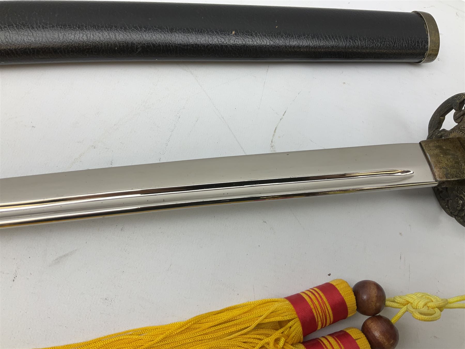 Three reproduction swords - Japanese katana and saya; Tai Chi sword with ornate scabbard; and dress sword with fullered triangular blade and horn handle (3)