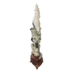 Chinese carved hardstone figure of Guanyin on wooden base, H31cm
