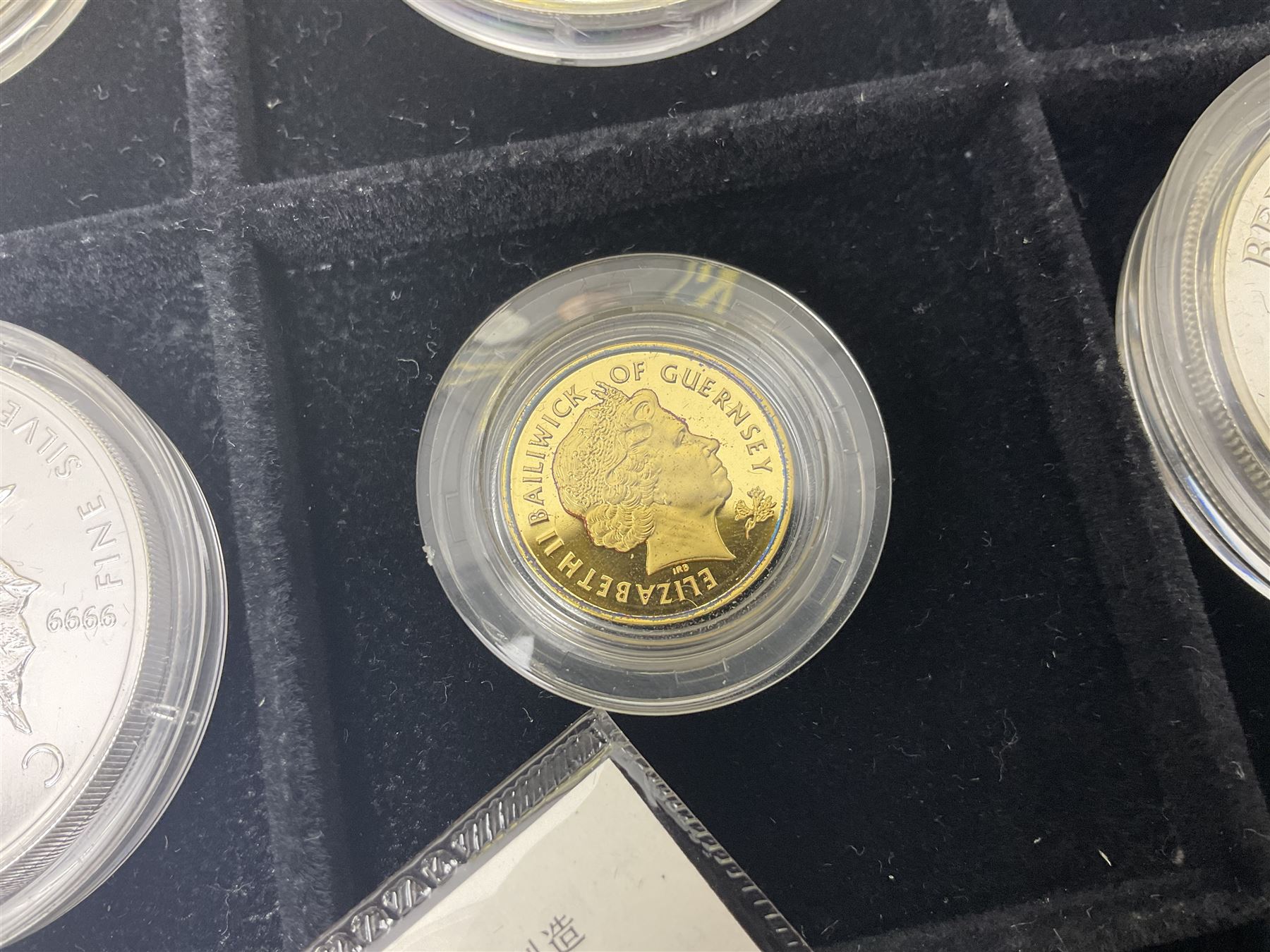Single owner lifetime collection of mostly commemorative modern World coins with gold, silver and base metal examples, including two Queen Elizabeth II Bailiwick of Guernsey twenty-five pound gold coins 'The 1999 Royal Wedding' and '100th Anniversary of the End of the Victorian Era' 2001 each in 24 carat gold weighing 7.81 grams with certificates, silver coins commemorating the Millennium 2000 including Guyana sterling silver proof two-thousand dollars, Fiji sterling silver proof five dollars etc, silver coins from the Queen Elizabeth II Golden Jubilee Collection dated either 2002 or 2003 from Great Britain and the Commonwealth countries, United Kingdom commemorative crowns in card folders, The Royal Mint United Kingdom 1997 proof coin set in red folder without certificate etc