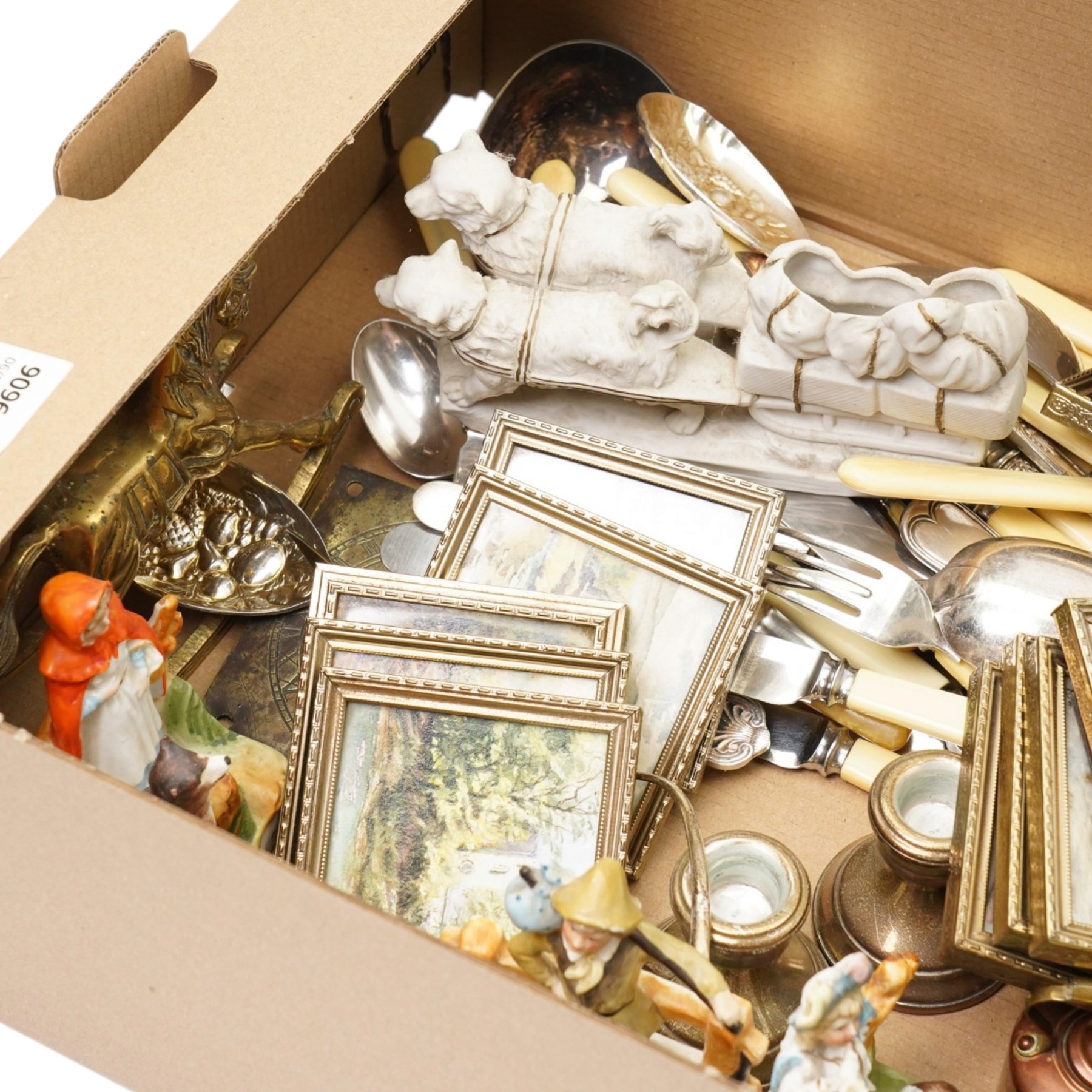 Collection of silver plated cutlery, silver candlesticks and pair of silver sugar tongues, brassware, jasperware biscuit barrel, set of miniature pictures, etc 