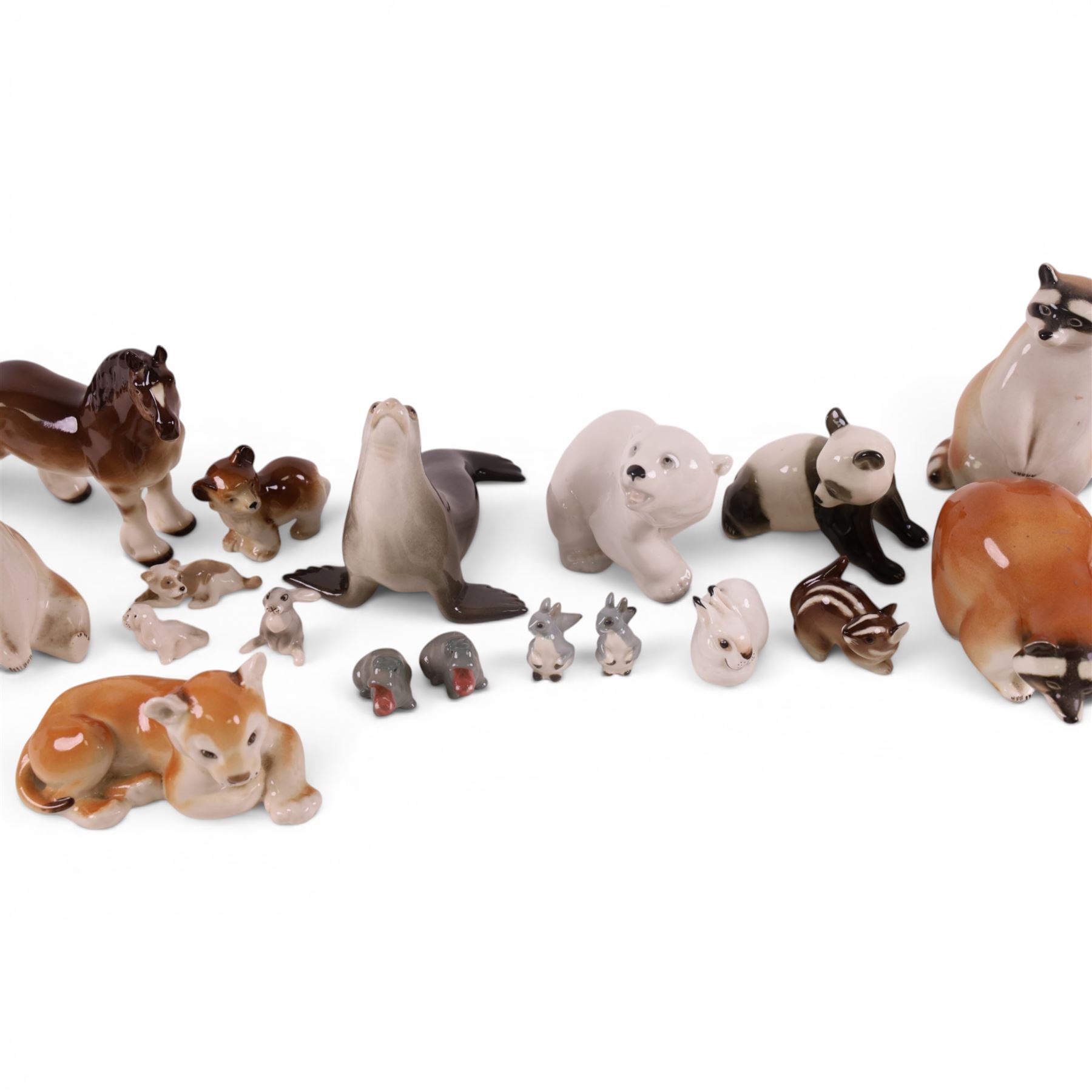 Collection of USSR Lomonosov figures, including racoons, sea lion, horse, lion cubs etc 
