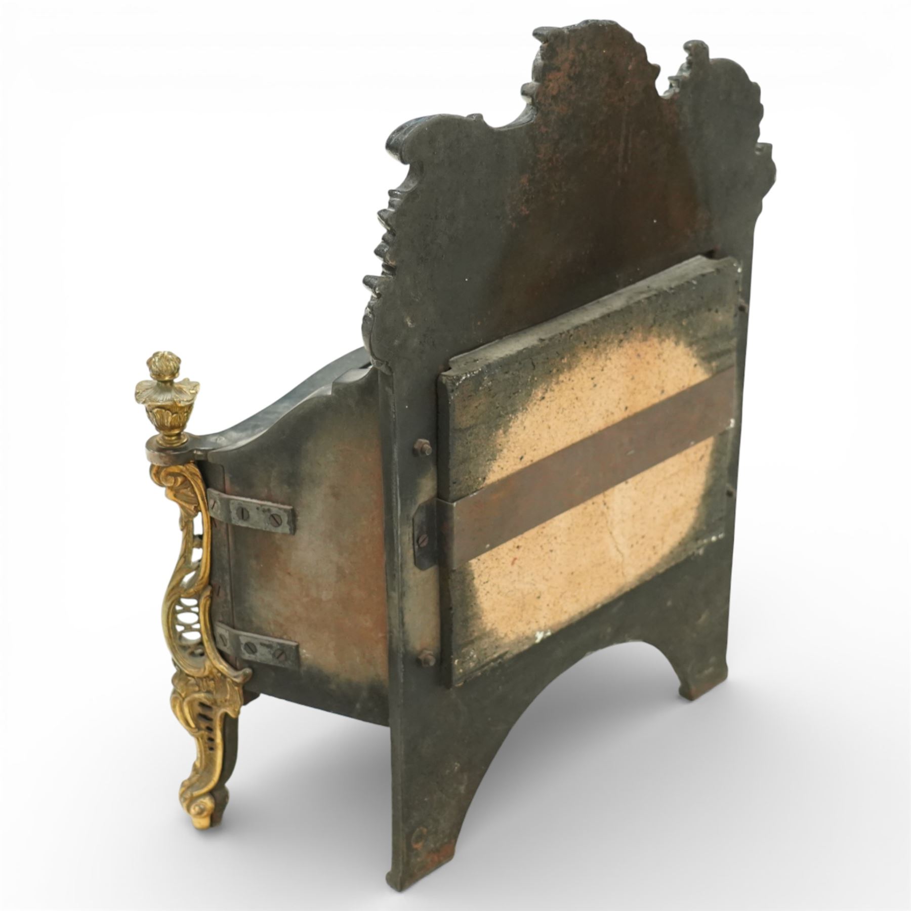 20th century Rococo style fire basket, cast iron back plate with pierced and scroll moulded cresting, steel fire bars and grate, ormolu mounted uprights with foliate scrollwork, on shaped feet