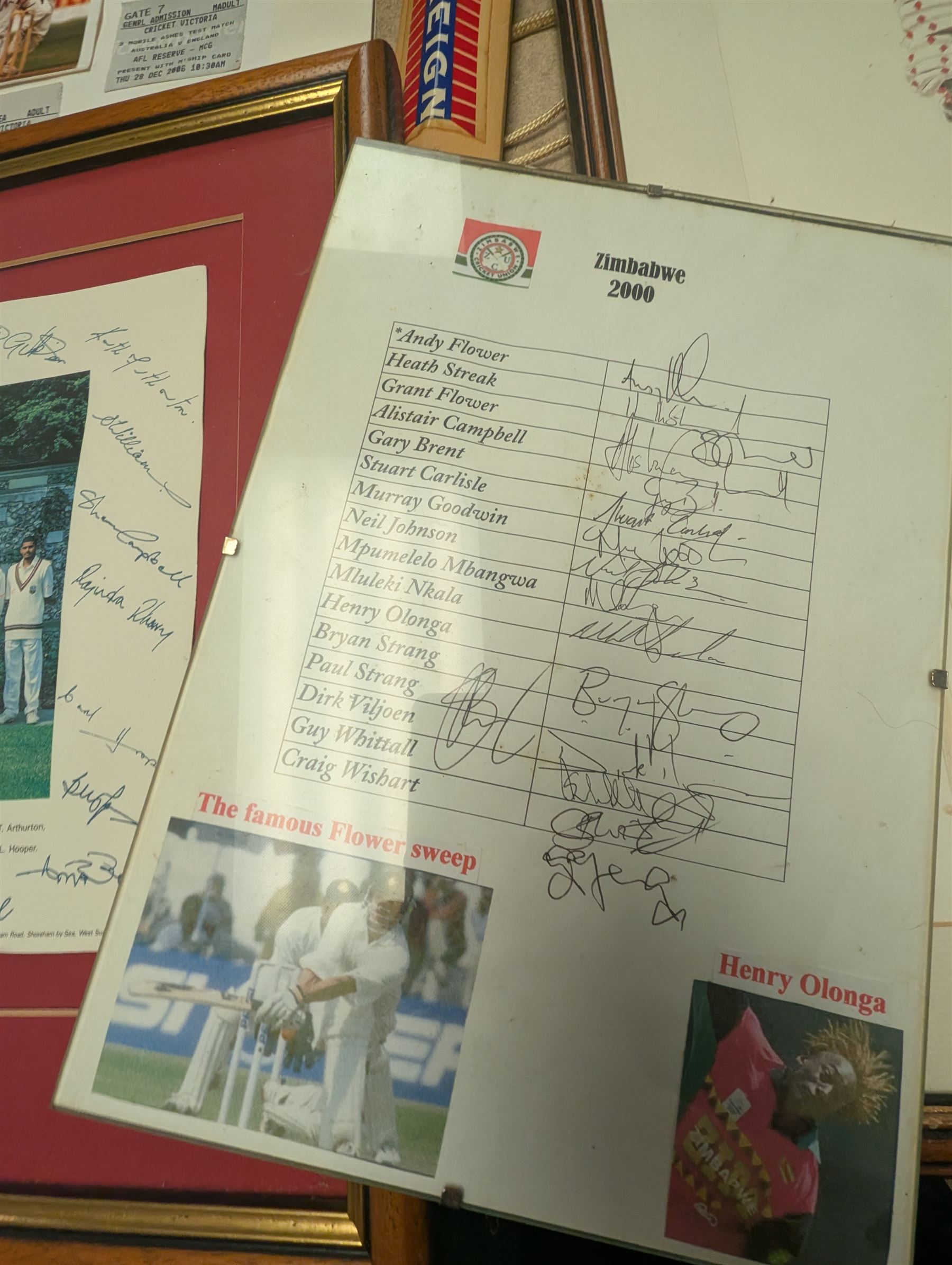 Collection of signed International cricket memorabilia, mostly relating to West Indies, including Curtly Ambrose and Brian Lara prints, Shane Warne and Glen McGrath last test souvenirs, signed Zimbabwe 2003 tour cricket bat, etc