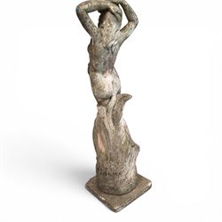 Two composition stone garden figures, comprising a seated boy figure and a standing classical draped female figure, each on square base, weathered painted finish.