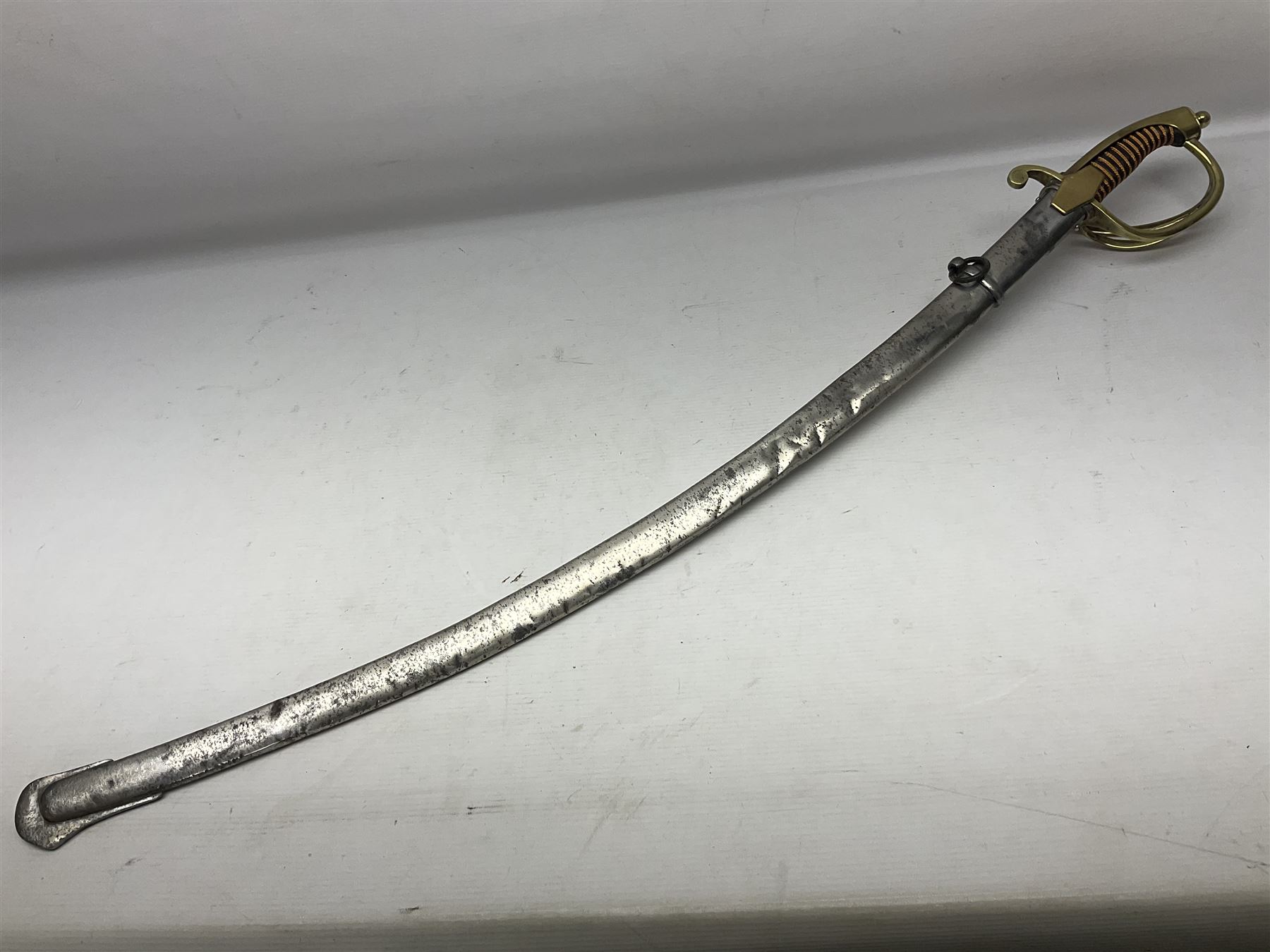 19th century Russian Imperial Navy sword, with 77.5cm curving fullered blade, brass three-bar hilt with lozenge shaped langets and wire-bound leather grip; in polished steel scabbard with one suspension ring L97cm overall