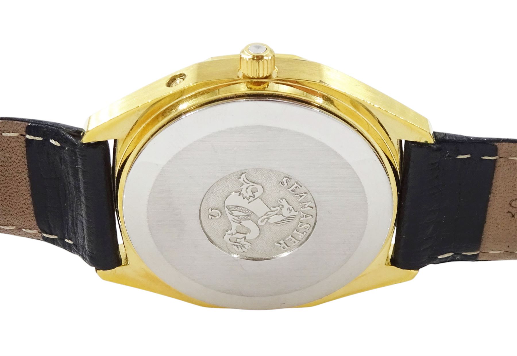 Omega Seamaster gentleman's gold-plated and stainless steel quartz wristwatch, Ref. 196.0126, Cal. 1345, black dial with baton hour markers and day - date aperture, on Omega black leather strap with buckle, boxed with Omega repair receipt dated 2023