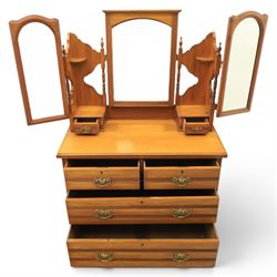 Edwardian satinwood dressing chest, rectangular moulded top over two short and two long drawers with brass drop handles, raised mirror back with arched central plate flanked by hinged side mirrors, small fitted trinket drawers and shaped pierced side supports with turned uprights