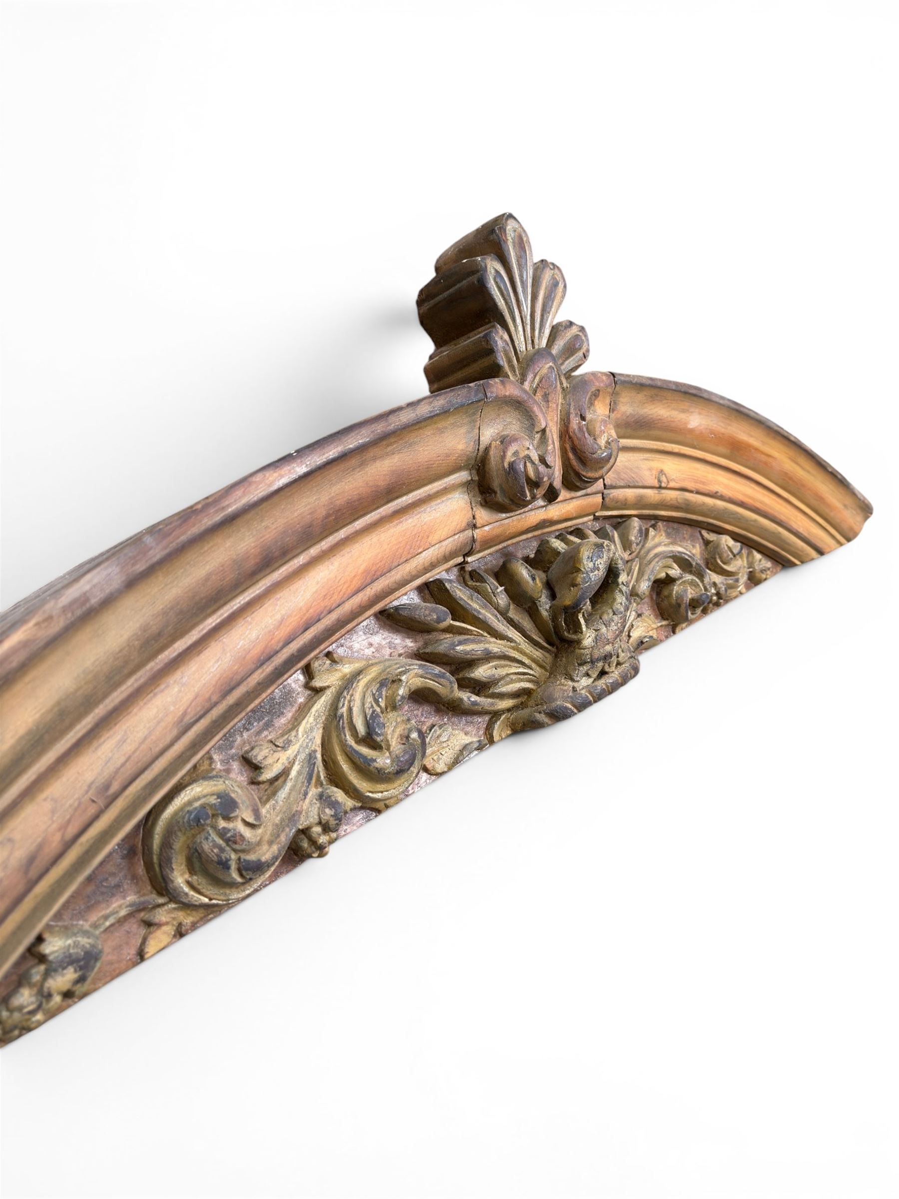 19th century carved pine architectural pediment, detailing floral swags with berries and central serpentine snake head 