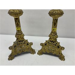Pair of gilt metal pricket candlesticks, with applied decoration on knopt stems and triform bases, H47cm