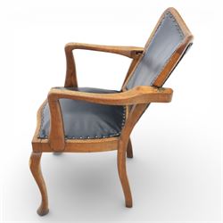 20th century oak recliner armchair, the curved back upholstered in leather with brass stud edging, hinged reclining back operated by side ratchet fittings, leather upholstered seat, shaped open arms, raised on cabriole legs