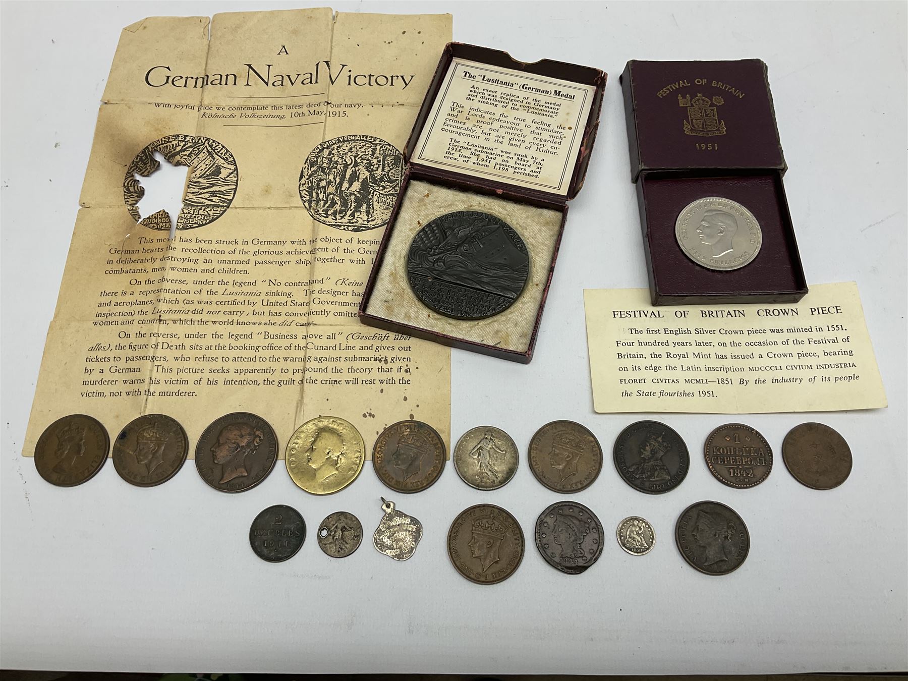 Lusitania replica medal, boxed and various coins including King George VI 1951 Festival of Britain crown, United States of America 1844 one cent and 1850 half dime, Queen Victoria States of Jersey 1844 one thirteenth of a shilling, etc