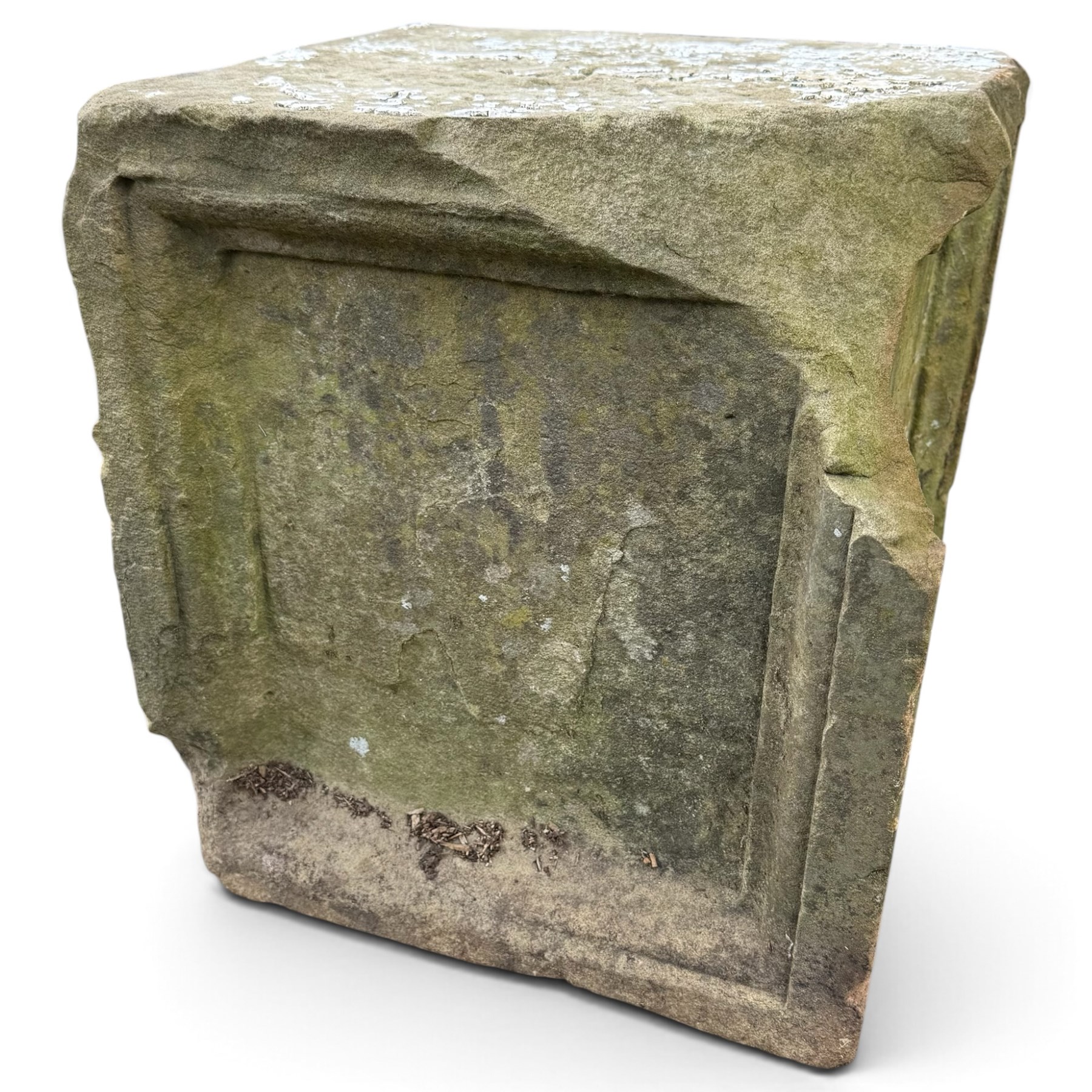 Two 18th century carved sandstone architectural elements, comprising a substantial square pedestal block with recessed panelled facias (W42cm H45cm); and a frieze fragment carved in relief with three stylised flowerheads and an undulating foliate stem (W30cm H18cm)